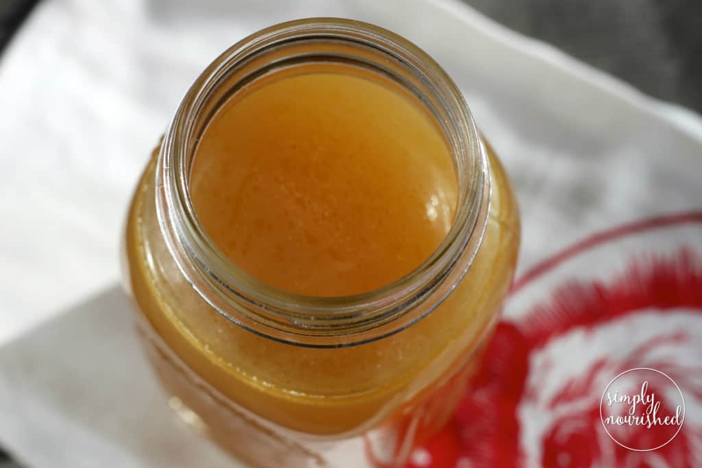 Overhead view of a mason jar filled with Bone Broth.