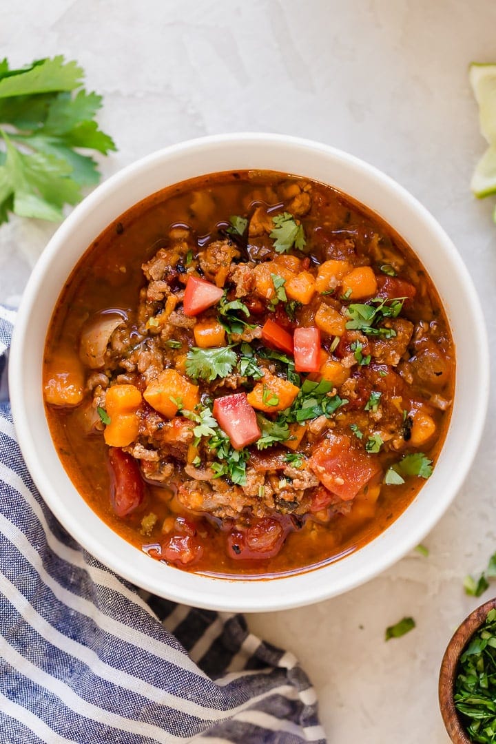 Overhead view of a bowl of slow cooker turkey chili topped with fresh cilantro.