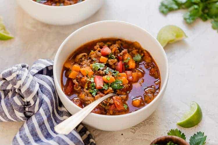 White bowl filled with chipotle turkey sweet potato chili
