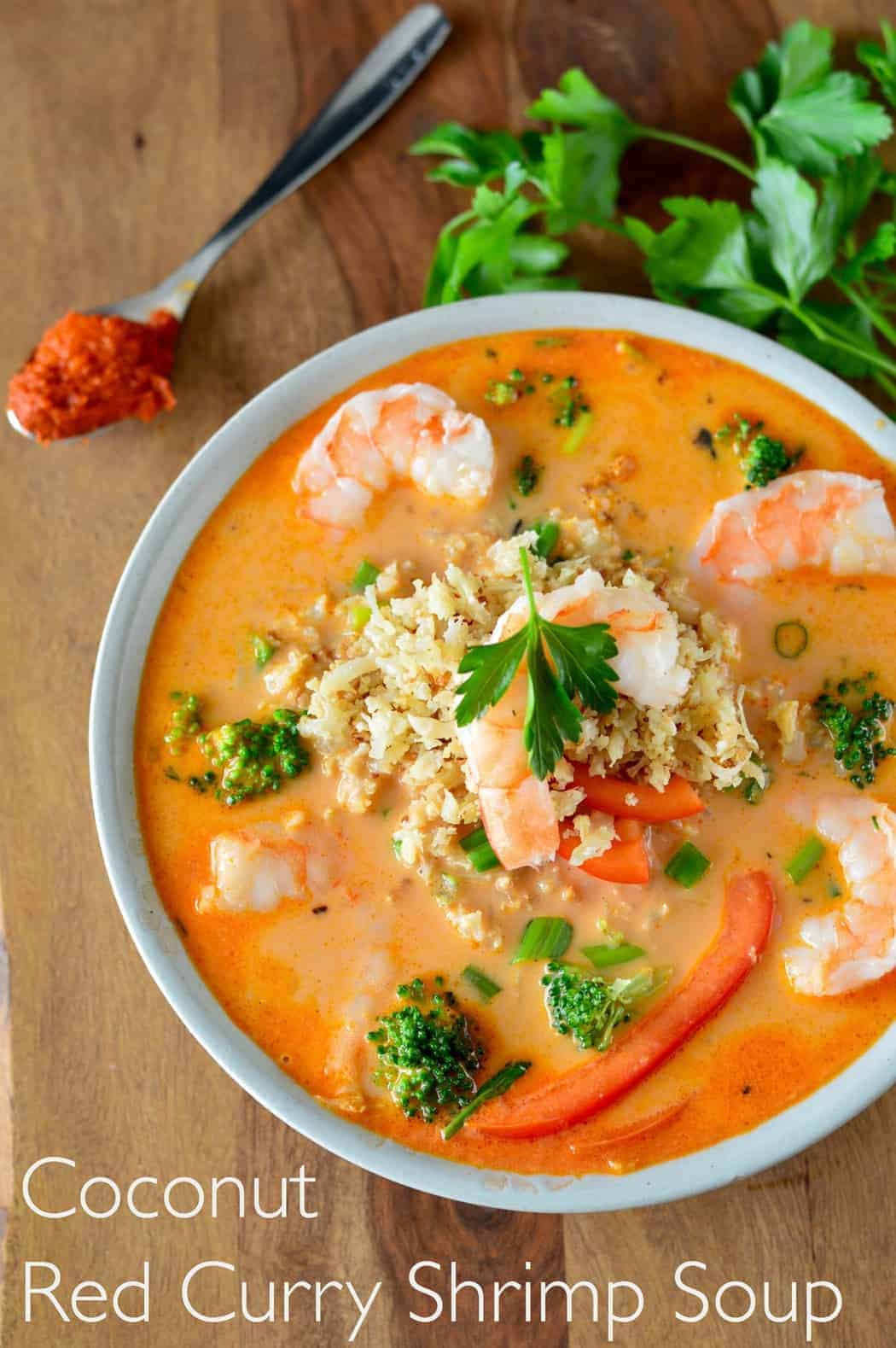 Overhead view of a bowl of Coconut Red Curry Shrimp Soup