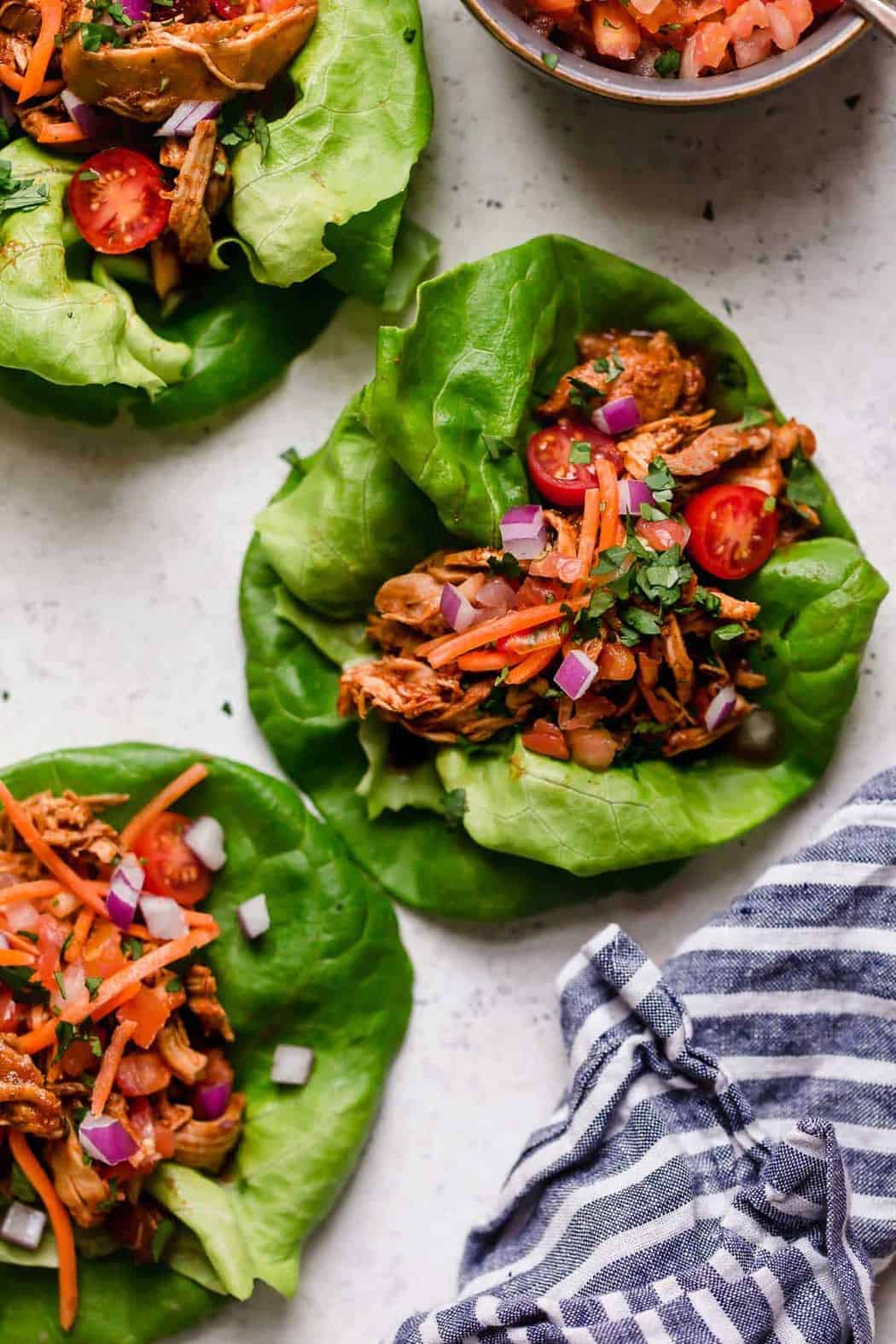 Slow Cooker shredded chicken tacos in lettuce leaves