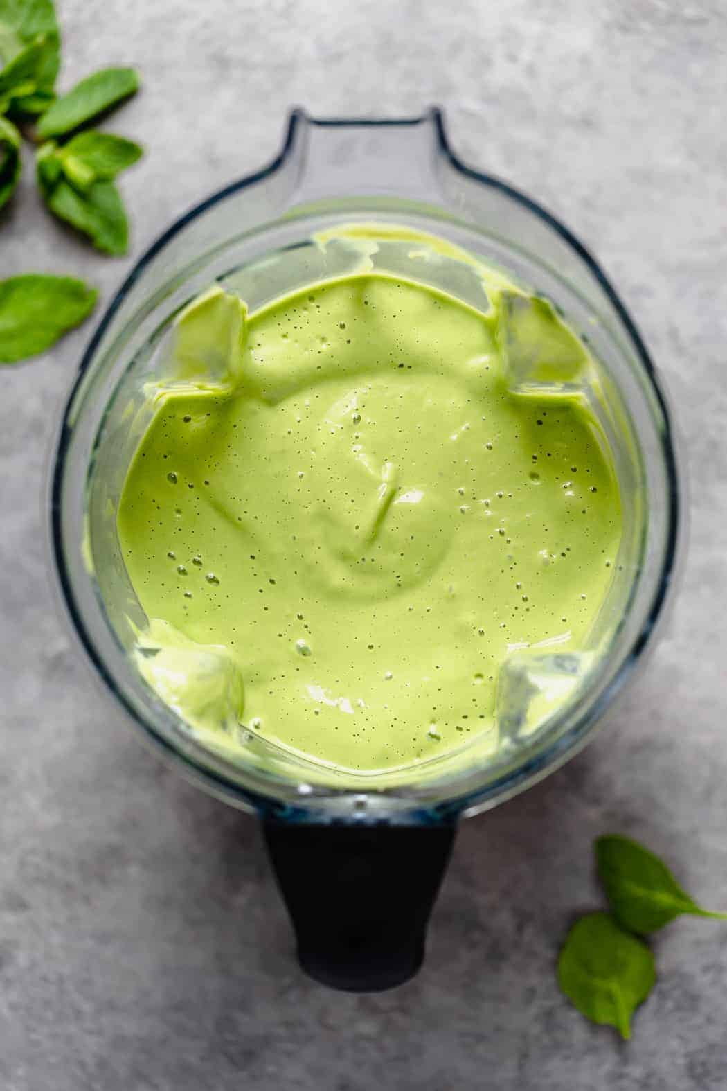 Creamy and smooth mint chocolate chip shake freshly blended still in the blender