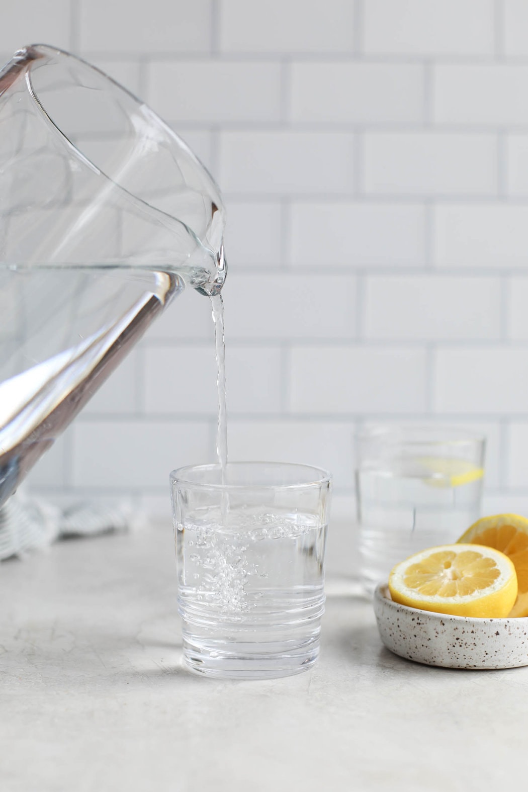 Close up view of water being poured into a glass