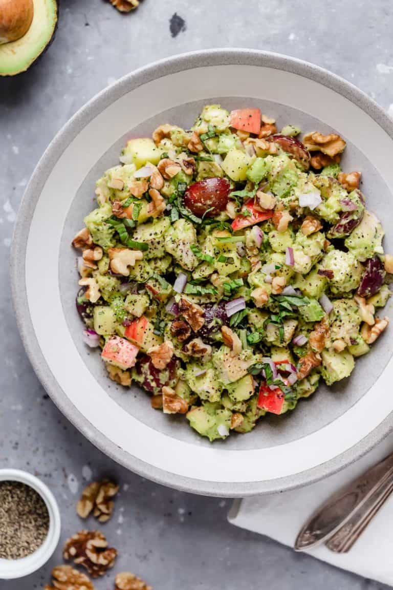 Avocado Waldorf chicken salad in a white bowl. 