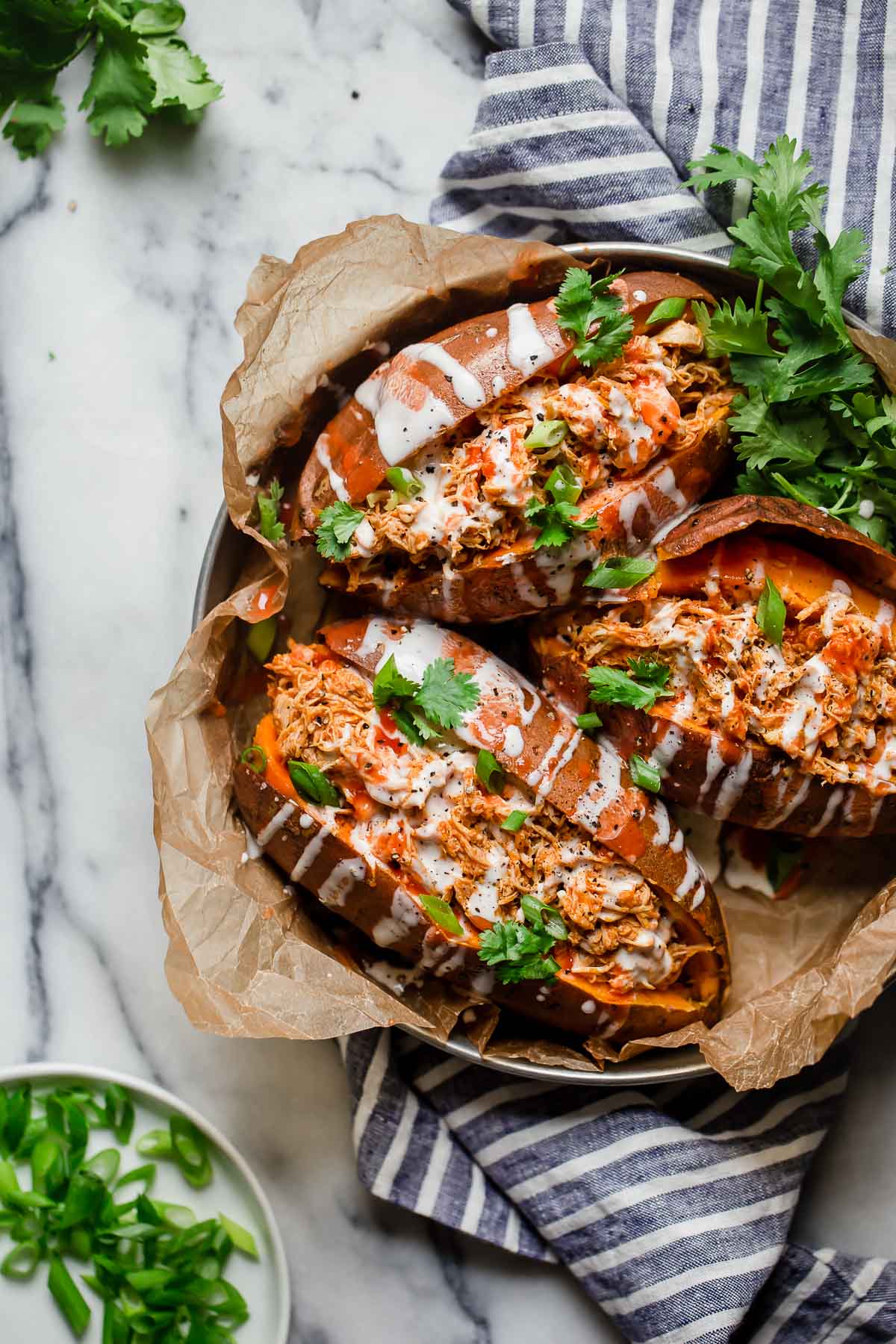 Three stuffed sweet potatoes with shredded buffalo chicken