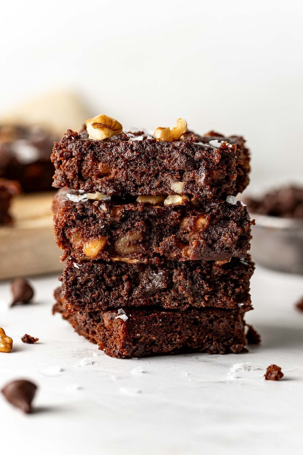Close up view of a stack of sweet potato brownies showing the fudgy texture. 
