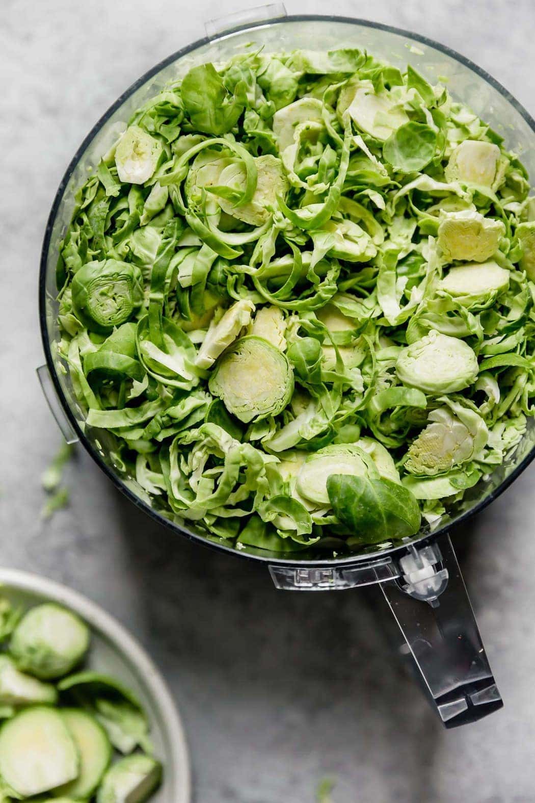 Overhead view of a bowl of shredded brussels sprouts