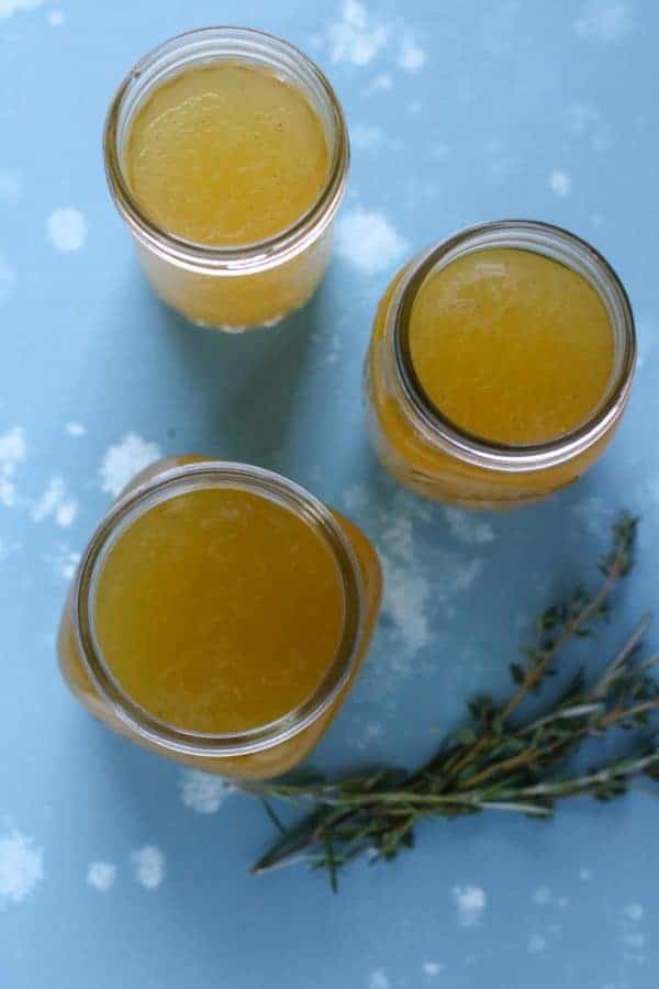 Overhead view of 3 mason jars filled with Bone Broth 