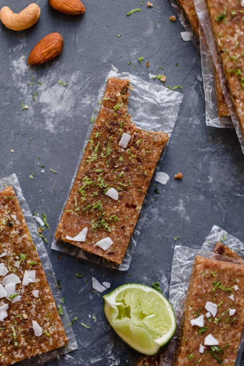 Overhead shot of the Key Lime Pie Energy Bars with one of them having a bite taken out of it.