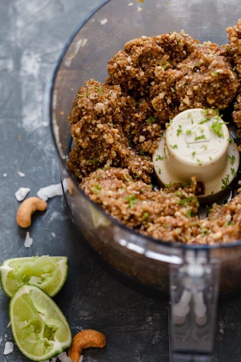 Overhead shot of the Key Lime Pie Energy Bars ingredients in a food processor after processing.