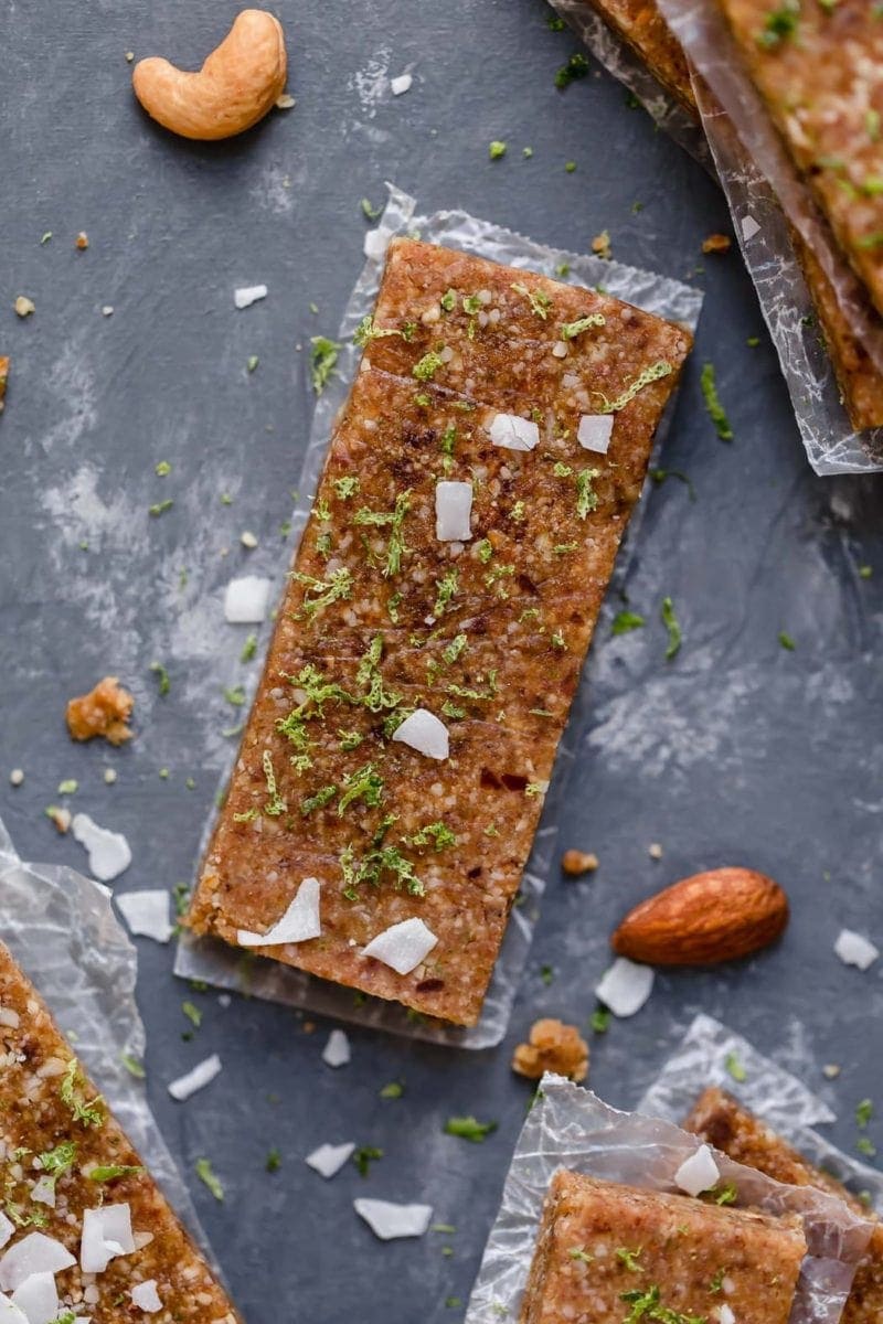 Overhead shot of Key Lime Energy Bars topped with grated lime zest and coconut shreds.