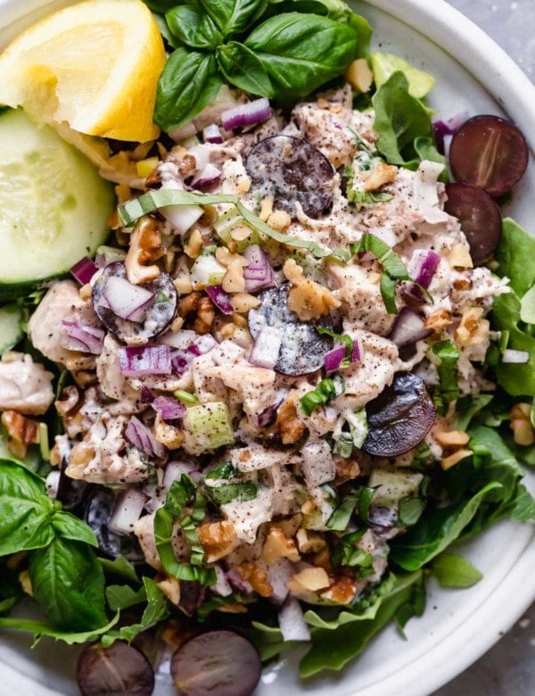 Chicken salad with grapes and walnuts served on a lettuce leaf