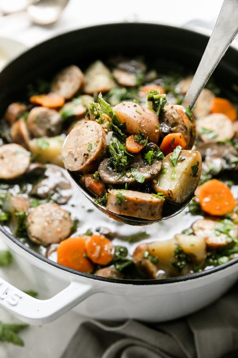 Close up view of a pot of Italian Soup being scooped with a ladle.