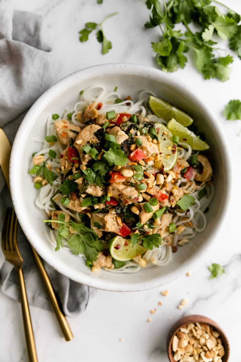 Thai-Inspired Peanut Chicken over a bowl of noodles. 