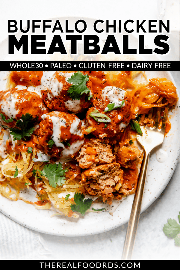 Buffalo chicken meatballs on top of spaghetti squash strands and drizzled with buffalo sauce and ranch dressing