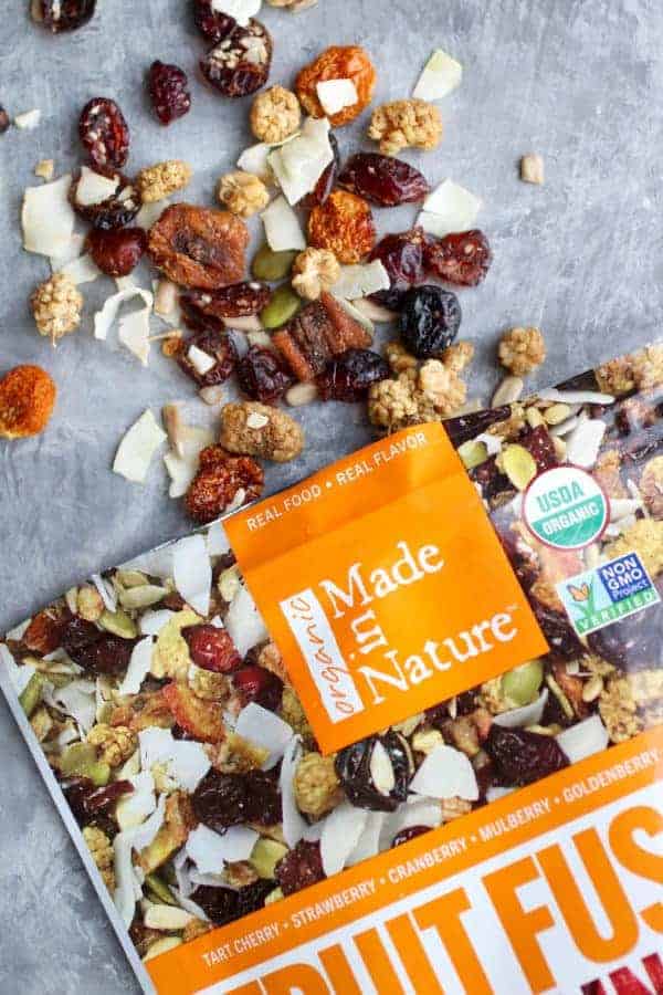 Bag of Made In Nature Fruit Fusion with trail mix coming out of bag.