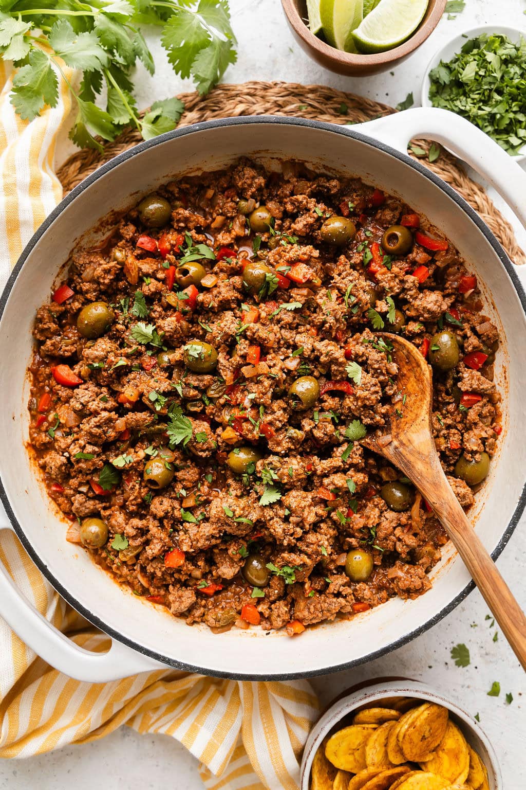 Overhead view of a skillet filled with Stovetop Picadillo topped with fresh cilantro.