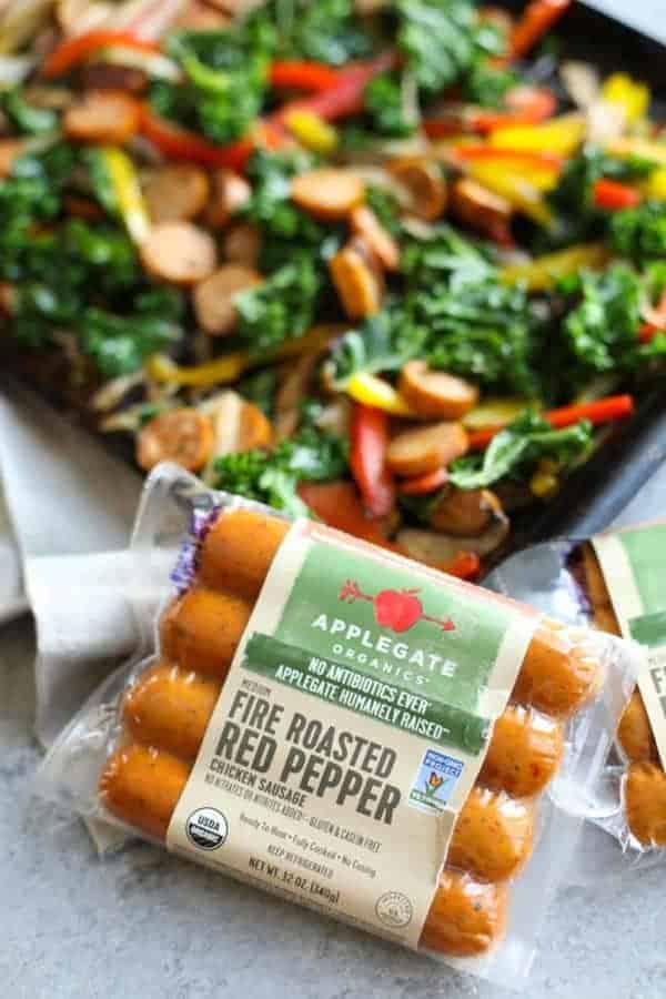 Package of Applegate Fire Roasted Red Pepper Chicken Sausage next to pan of vegetables ready for the grill.