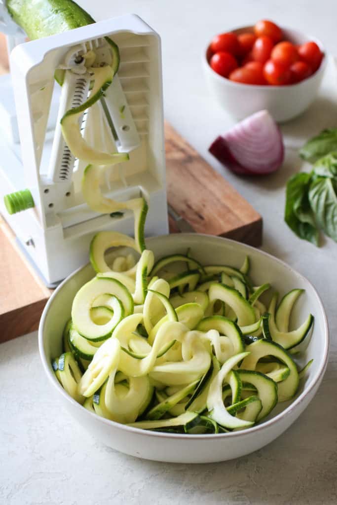 Zucchini noodles in a white bowl