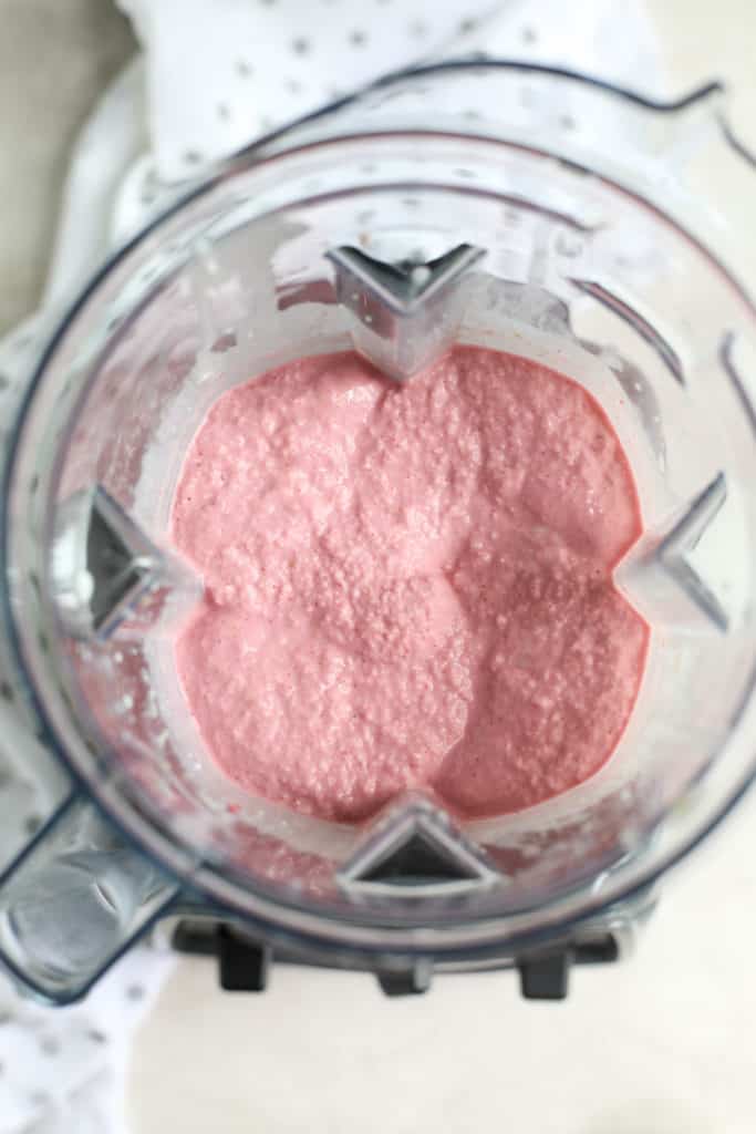 Strawberry Cheesecake Smoothie blending in a blender