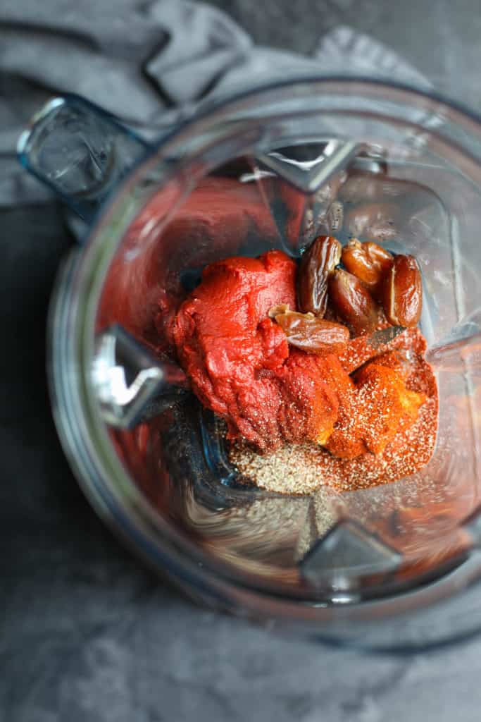 Overhead shot of blender container with ingredients for BBQ sauce