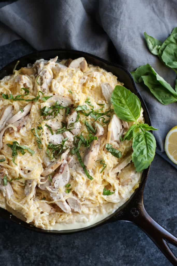 Aerial view of Dairy Free Spaghetti Squash Chicken Alfredo in a black skillet