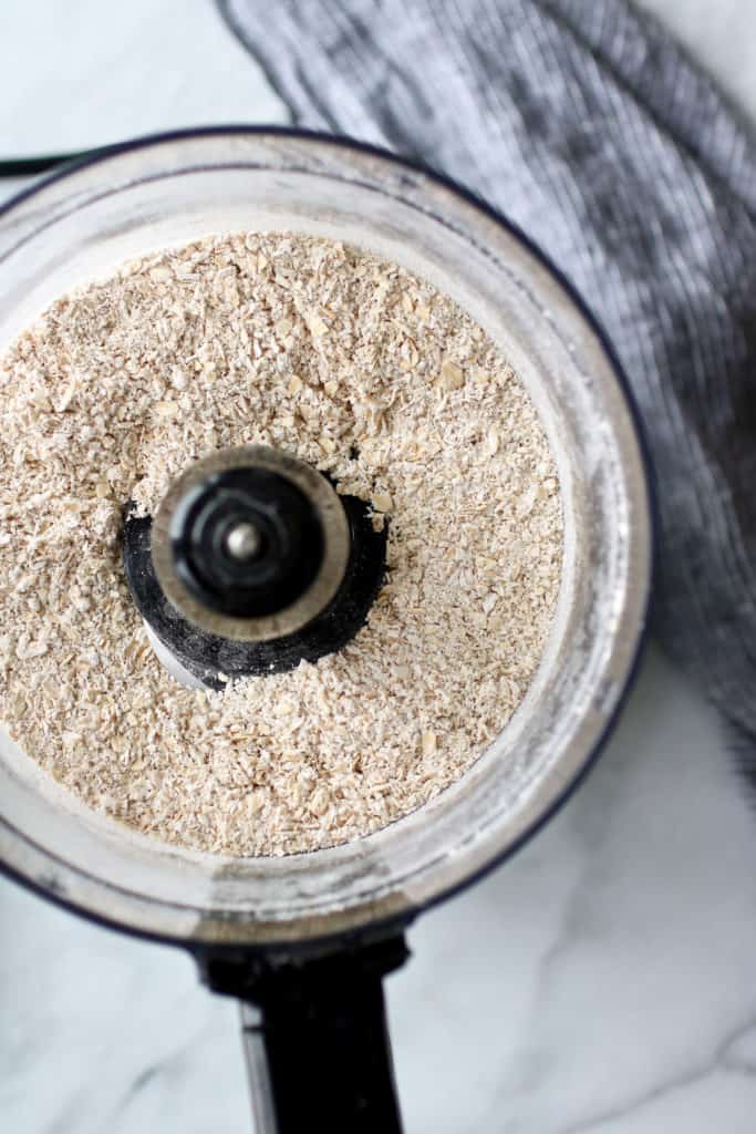 Processes oats in food processor bowl