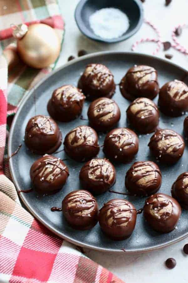 Overhead view of Healthy Buckeyes (Peanut Butter Balls) on a gray tray