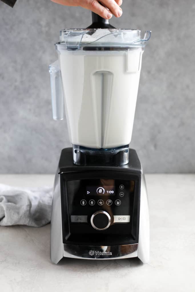 Close up view of a blender blending cream