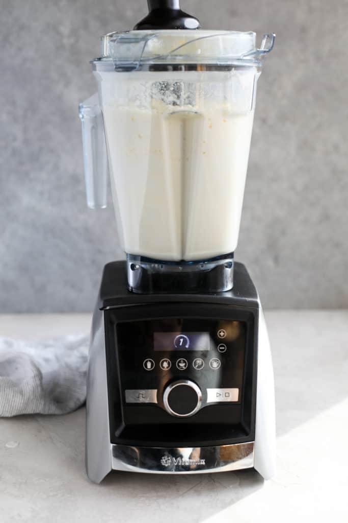 Cream blending into butter in a vitamix blender