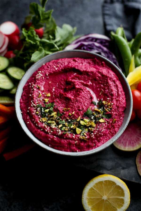 Overhead view of a colorful bowl of Beet Hummus