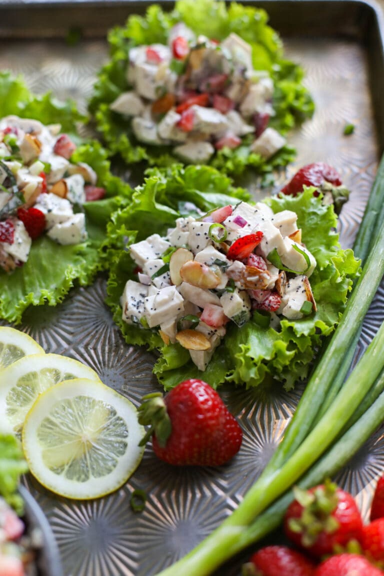 Strawberry Chicken Poppy Seed Salad served on three lettuce wraps. 