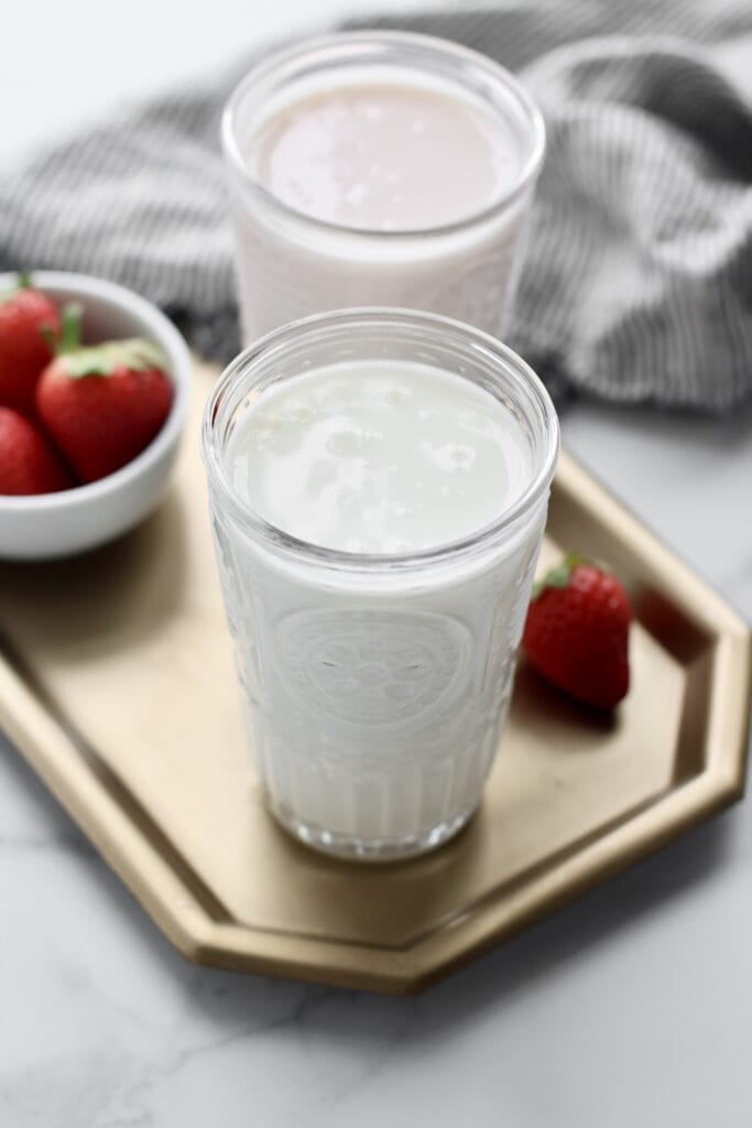 Close up view of two glasses of kefir.