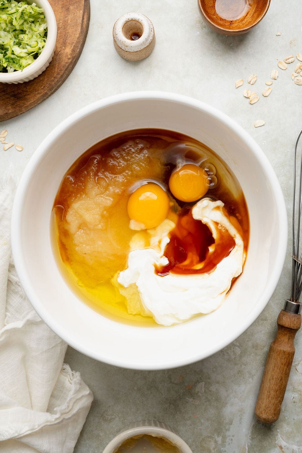 Wet ingredients for baked oatmeal cups in a bowl.