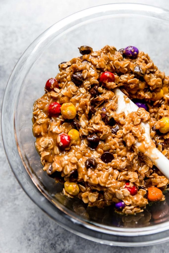 Clear glass bowl with Monster Cookie dough.