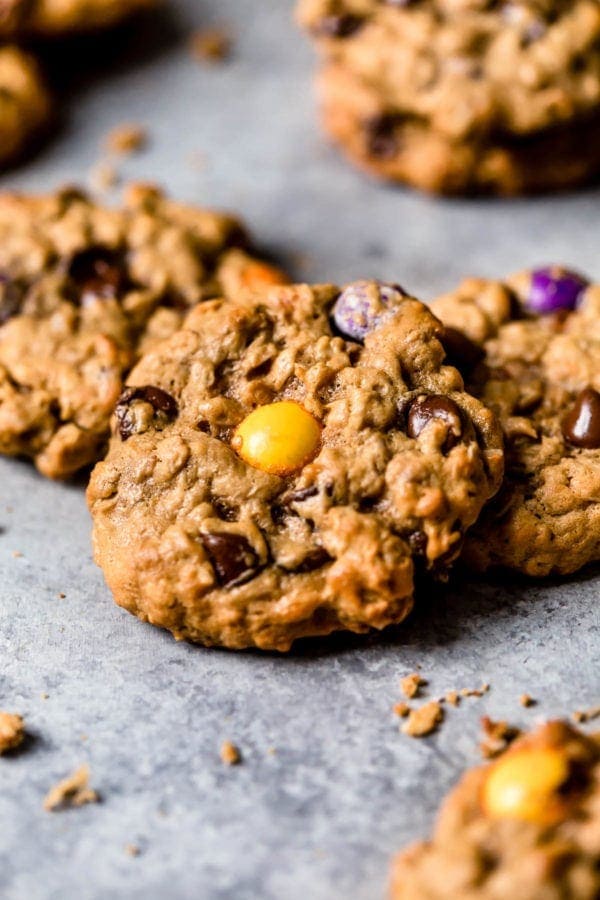 A close up The Best Monster Cookies studded with colored candy pieces and fresh from the oven. 