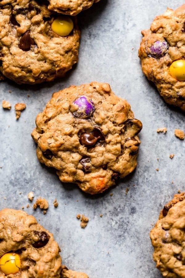 Overhead view of The Best Monster Cookies studded with colored candy pieces and fresh from the oven. 