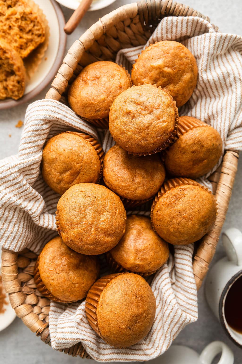 Overhead view of a basket filled with freshly baked Sweet Potato Muffins..
