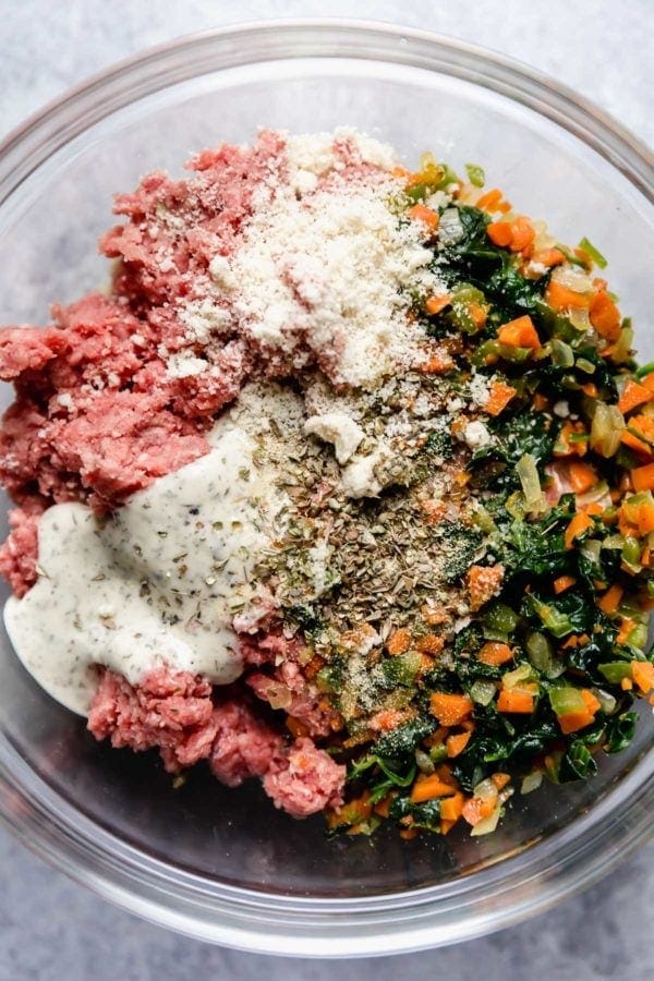 Overhead view of a glass bowl of Meal Prep Meatball ingredients