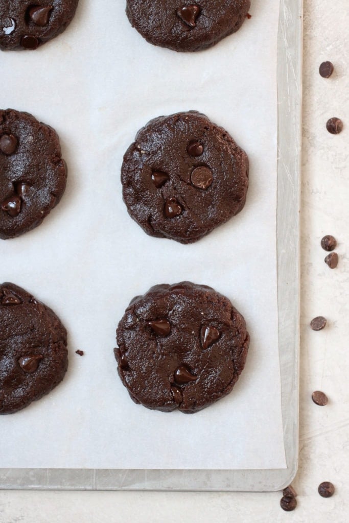 Photo of Chocolate Peanut Butter Protein Cookies on a baking sheet before going into the oven. 