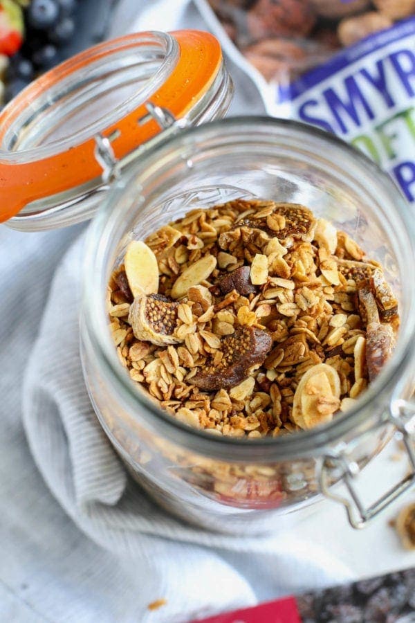 A glass jar filled with Maple Cinnamon Granola
