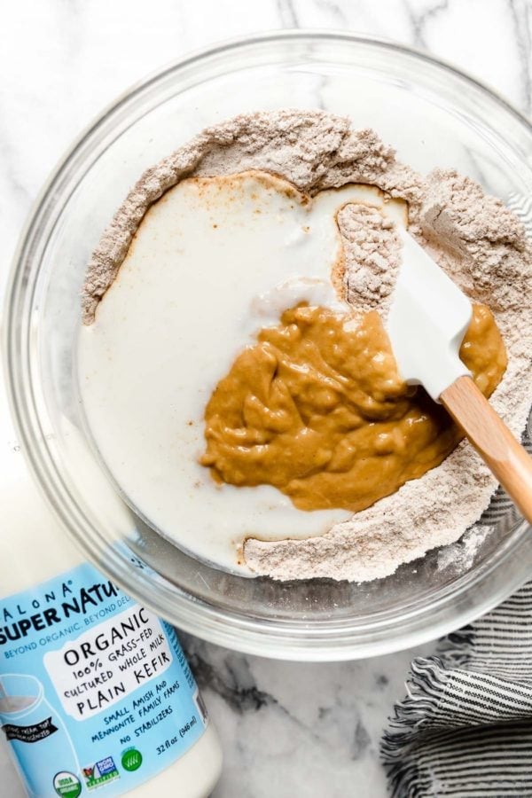 Ingredients for Gluten-Free Peanut Butter Banana Waffles in a glass bowl