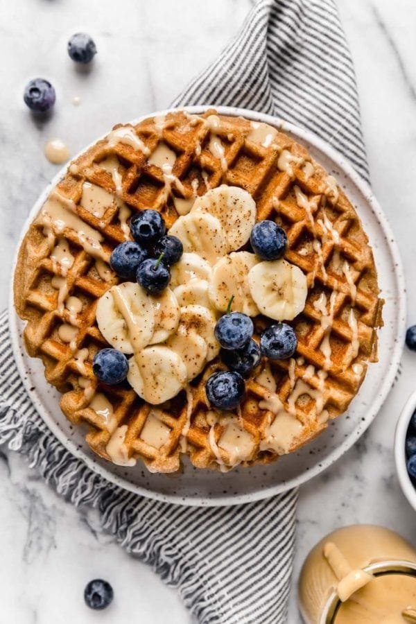 Overhead view of a plate of Gluten-Free Peanut Butter Banana Waffles