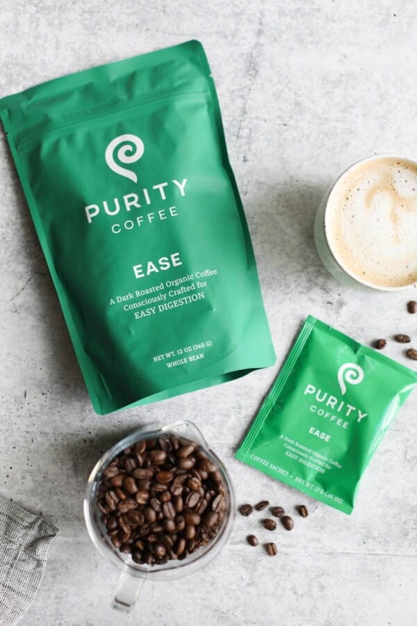 Overhead view of a bag of purity coffee and coffee beans on the side