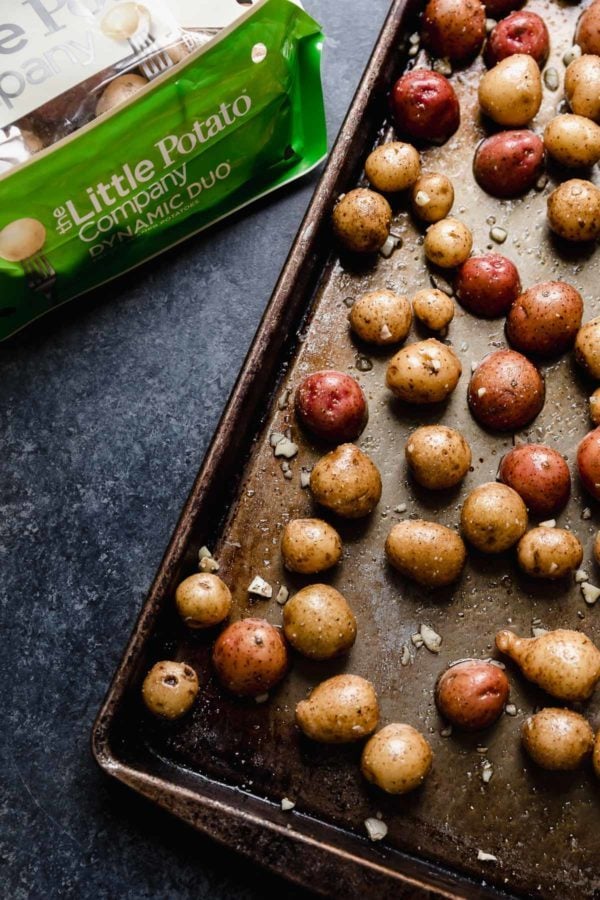 Overhead view of baby potatoes on a sheet pan
