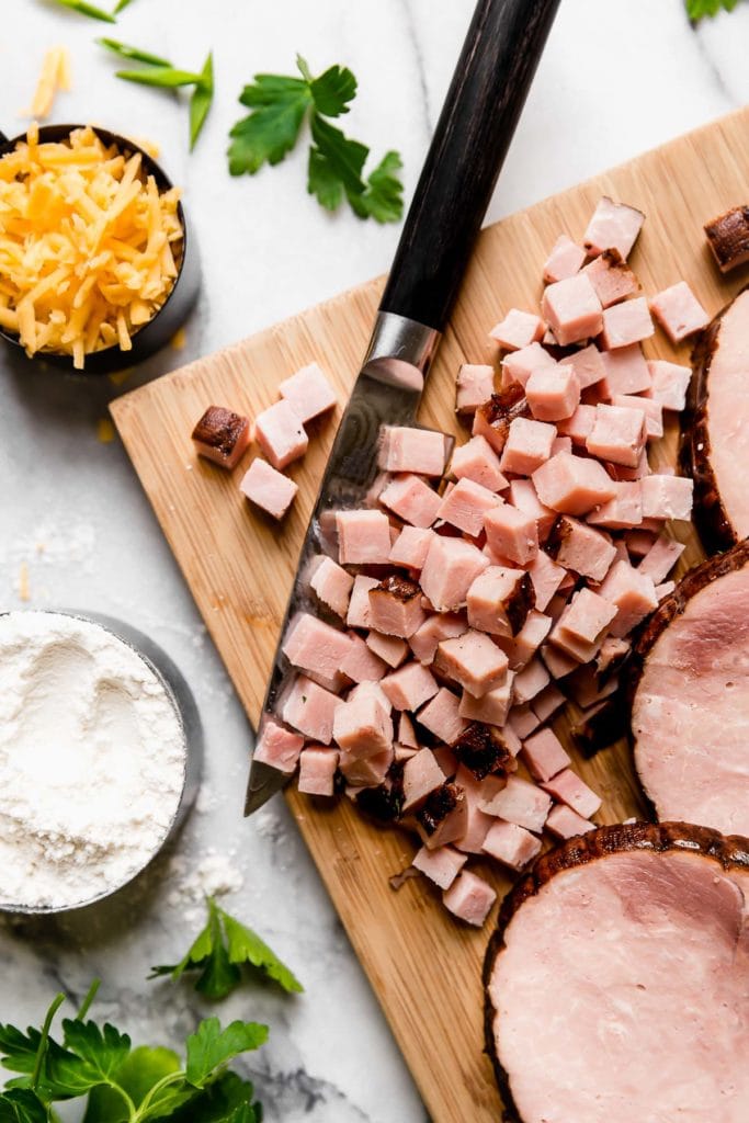 Savory Ham & Cheese Muffins Ingredients on a Cutting Board