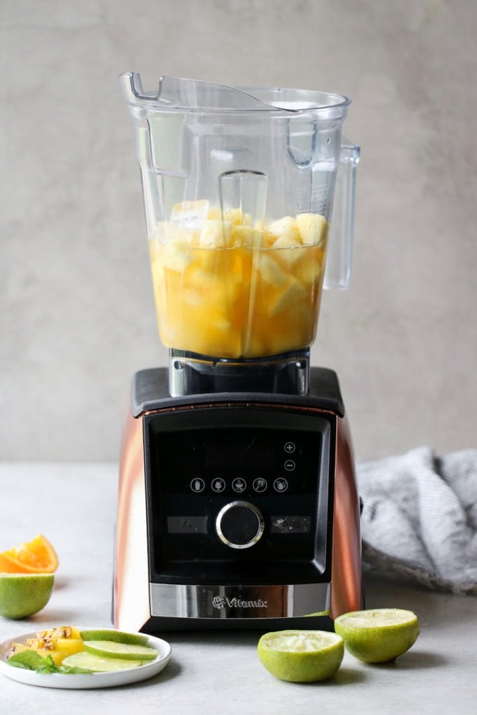 Photo of blender filled with the ingredients for the Frozen Pineapple Margaritas
