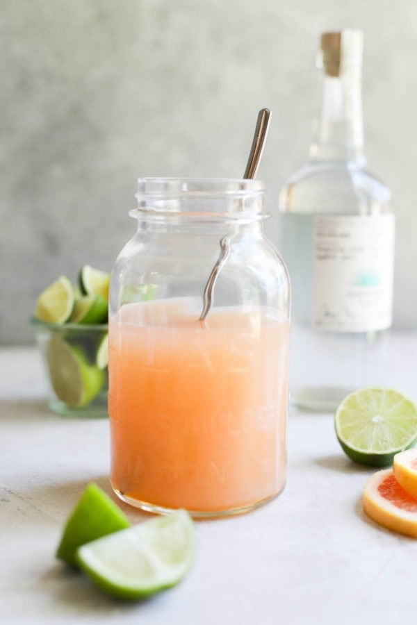 A mason jar filled with Low-Sugar Paloma