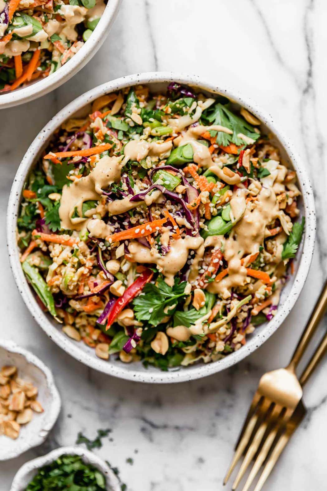 Thai Peanut Quinoa Salad Served in a White Stone Bowl