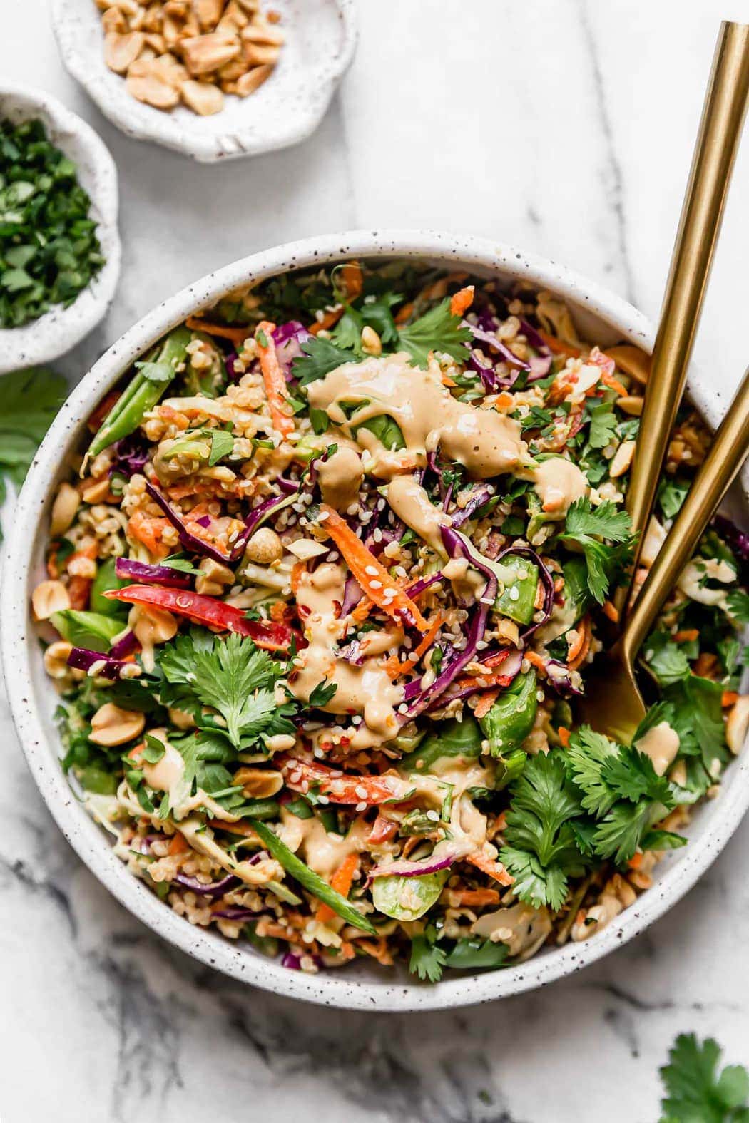 Thai Peanut Quinoa Salad Served in a White Stone Bowl